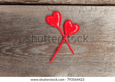 Valentine background concept with red hearts on rustic wood. Happy lovers day card mockup, copy space