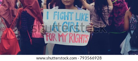 this is a women march in Jakarta, Indonesia, 2016; some of the sign is in Bahasa, but its all about women rights