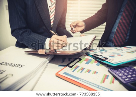 Business team financial inspector and secretary making report,tax,calculating or checking balance, Audit concept at working with plan and analyzing investment charts at workplace.