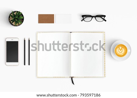 Modern workspace with coffee cup, smartphone, paper, notebook, tablet copy space on white color background. Top view. Flat lay style.