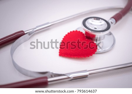 Red heart with Stethoscope on white background using as health care concept.