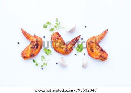 
Grilled chicken wings with vegetable and spices flat lay on white background, food ideas concept  Royalty-Free Stock Photo #793632046