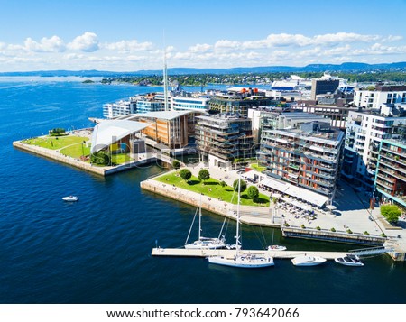 Oslo harbor or harbour at the Aker Brygge neighbourhood in Oslo. Oslo is the capital of Norway. Royalty-Free Stock Photo #793642066