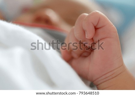 Newborn baby hand while sleeping