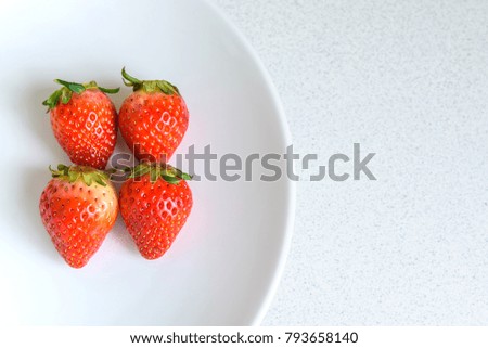 Strawberry on the plate with copy space, selective focus