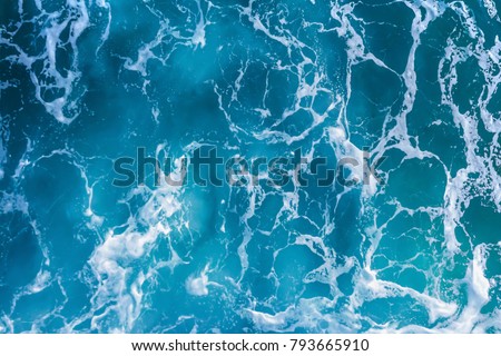 Abstract blue sea water with white foam for background, nature background concept Royalty-Free Stock Photo #793665910