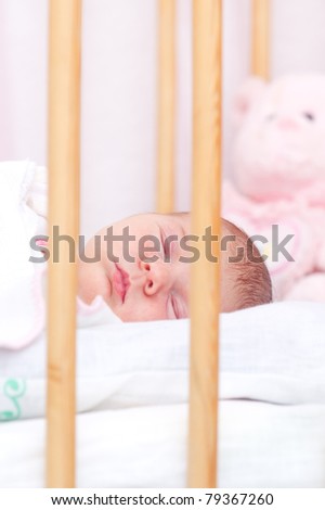 picture of a newborn baby sleeping in baby crib