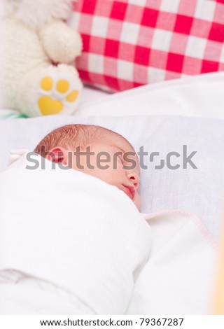picture of a newborn baby sleeping in baby crib
