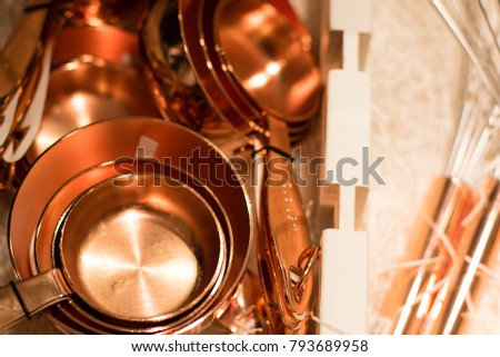 Copper measuring cups/spoons in sets of different sizes on display