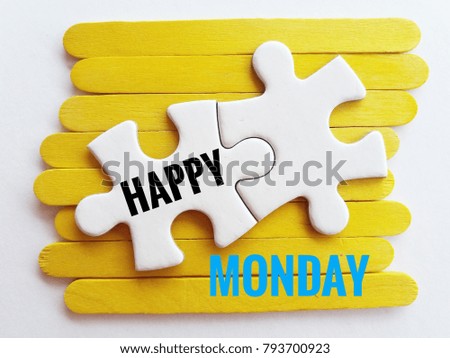 concept image of jigsaw puzzle and ice cream sticks and word - HAPPY MONDAY with white background