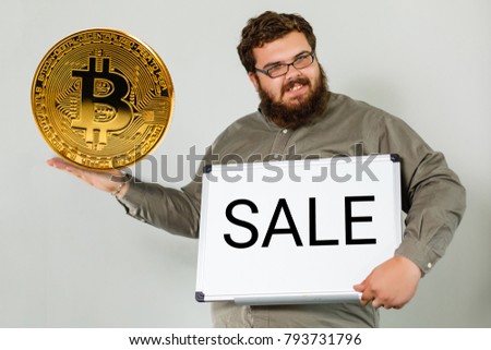 Blockchain concept rise of bitcoin price business man holding showing bitcoin on screen