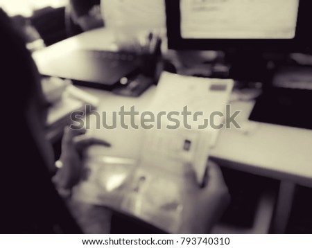 A woman immigration officer checks the passports of foreigners in hand, immigration, blurred image