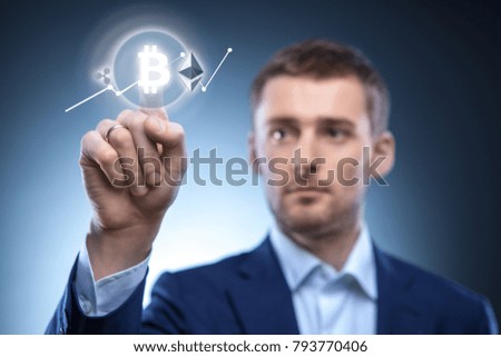 the man clicks Icon Bitcoin on virtual screen.