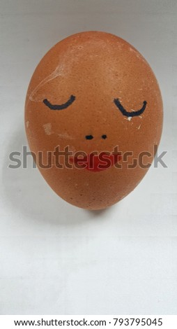 Sleeping lady face on Easter egg on white background