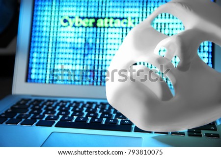 White mask on laptop keyboard, closeup