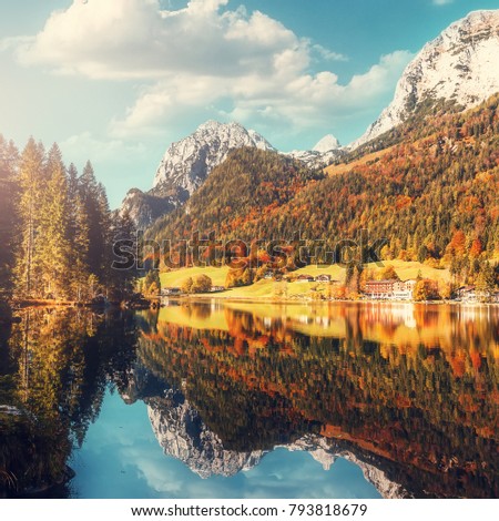 Fairy-tale  lake Hintersee in sunny day, with Perfect sky reflective in the water. Magic Painterly Scene in European Alps. Popular Photography Locations. Ideas for Great Travels. Beauty in the world