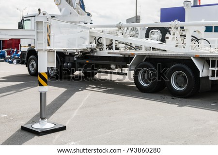 hydraulic outriggers of the crane installed on the truck. different parts of Construction machinery Royalty-Free Stock Photo #793860280