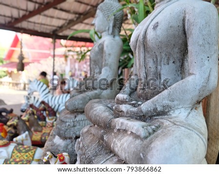part of weathered mortar Statue of Buddha and focus image at meditation hand of statue with that  texture and blurred any composition point in picture . concept meditation of Buddha  