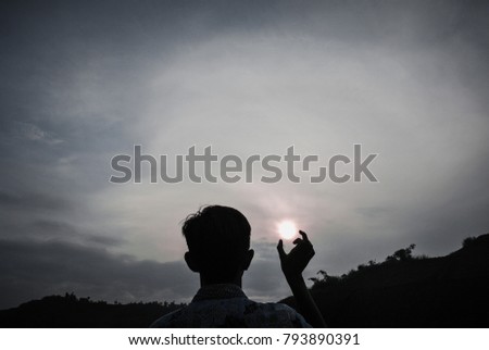 Silhouette photography of person catching the sun with gloomy style 