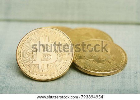 bitcoin coin on the flower pattern cloth.