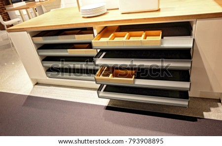 Drawer and cutlery tray for organizing kitchen equipment.
