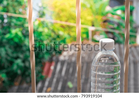 Bottle water made to plastic on the wood background.Using wallpaper for package or product, drug image and copy space.