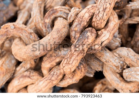 Rusty chains randomly scattered not being used or needed anymore
