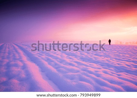 Silhouette of man in winter landscape. Photo with edit space