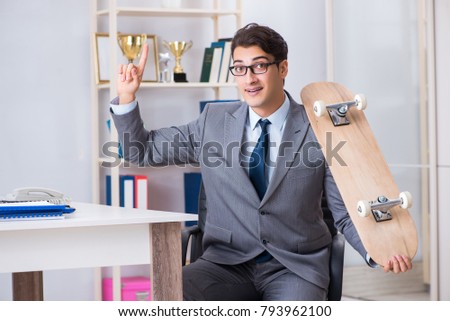 Young businessman riding skate in office during break