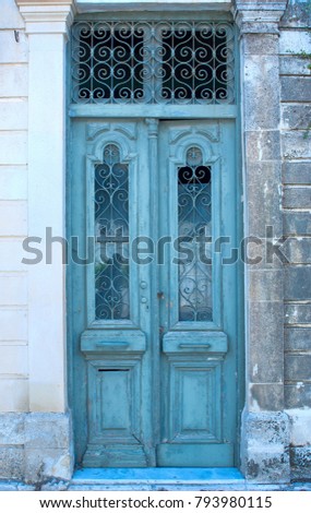 Old door with a lattice in Greece
