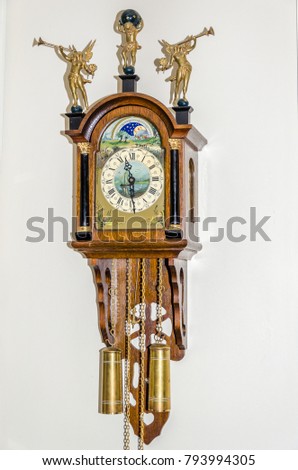 Antique old retro wooden wall vintage clock  with silver and gold 