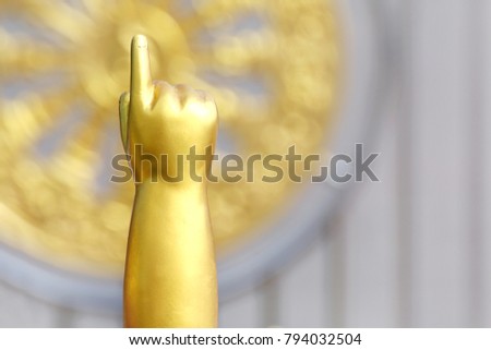 Arms and index fingers of Buddha child, baby Buddha gold statue, Buddha golden