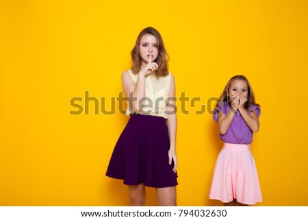 two girls shut mouth silence