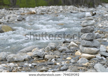 Tower of stones on a mountain river