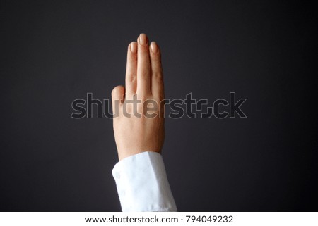 Young Woman's Hand Shows Three Fingers Gesture