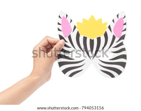 hand holding zebra animal carnival mask isolated on white background
