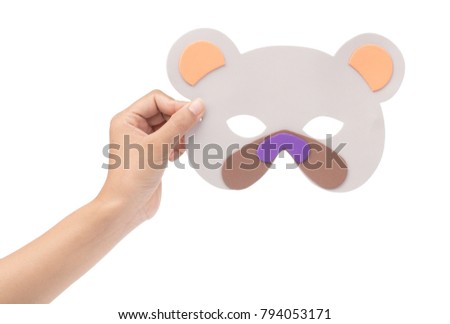 hand holding Bear carnival mask isolated on white background