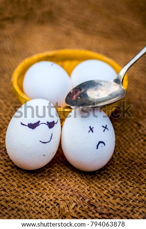 Close up of eggs with an spoon on them.