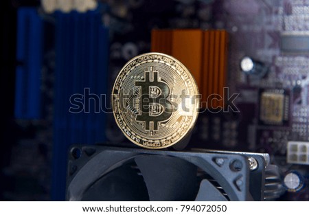 Gold Bitcoin electronic computer processor board. Virtual cryptocurrency concept