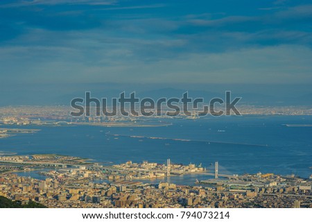 Aerial view to Kobe city business downtown and Port Island of Kobe from Mount Rokko skyline and cityscape of Kobe Hyogo Prefecture Japan. abstract background for tourism to travel in Japan