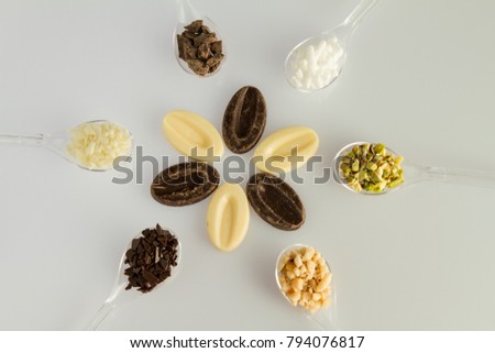 A composition of some dry ingredients for sweeties and cake on white background