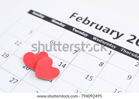 Valentines Day background with red hearts paper on Calendar page 