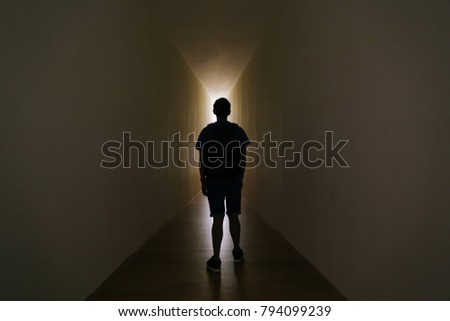 Man walking out of the tunnel cave, end of the light