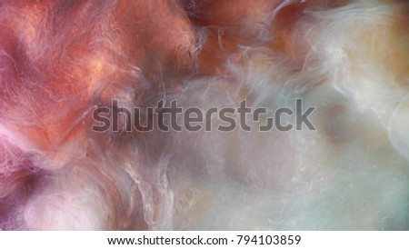 Colorful red/white paint drops mixing in water. Ink swirling underwater. Colored acrylic cloud abstract smoke explosion. Close up view