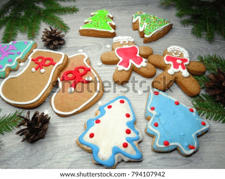 christmas cookies and gingerbread traditional food on wooden board fir branches 