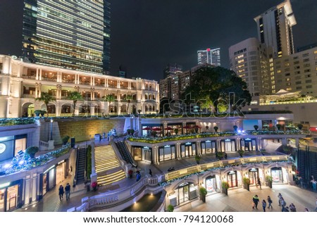 Old and modern buildings in Tsim Sha Tsui district, Hong Kong city at night Royalty-Free Stock Photo #794120068