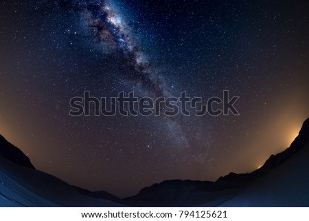 Namibian sky, stars and Milky Way arch, in the Namib desert, Namibia, Africa. Fish eye view, dark sand dunes. Royalty-Free Stock Photo #794125621