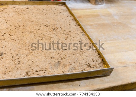 ingredients needed for preparation of baked goods in a bakery with tools for preparing pastries if letters are visible they are no logos or trademarrks but name of materials for baking