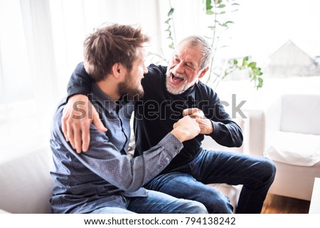 Hipster son with his senior father at home. Royalty-Free Stock Photo #794138242