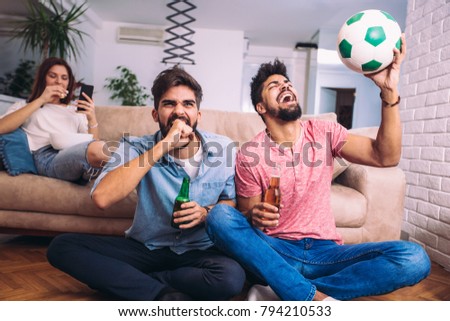 Group of multi national football fans cheering